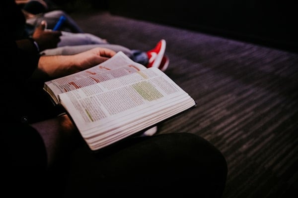 Students reading Bible during chapel at Sunshine Bible Academy